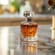 A bottle of perfume on a counter